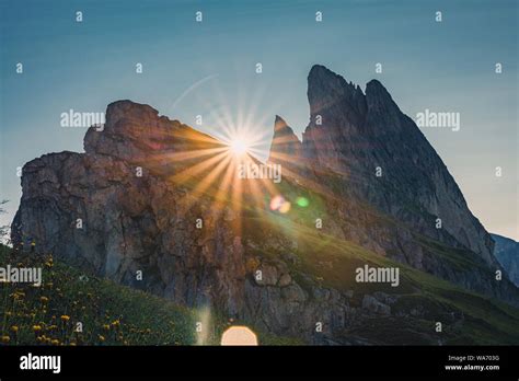 Beautiful View On Seceda Mountain On Sunrise With Sun Rays In Dolomites