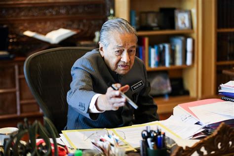 1.3 billion people cannot be simply wiped out. Tun Dr Mahathir Mohamad reaches for a Pilot pen during an ...