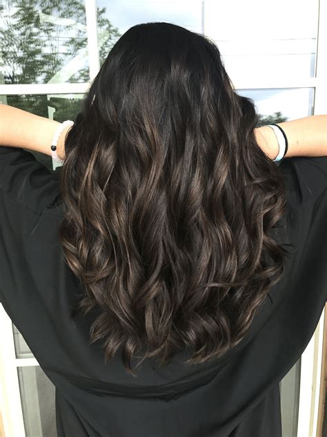 dark brown hair with subtle peekaboo highlights in 2019 brown hair balayage hair highlights