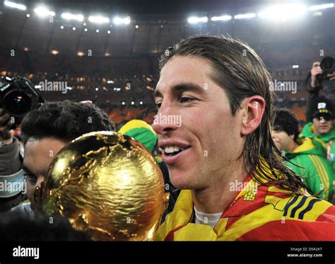 Sergio Ramos Of Spain Celebrates With The Trophy After The 2010 Fifa