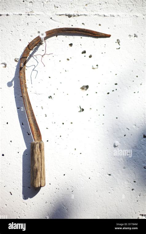 Old Rusty Scythe Hanging On A Sunlit Wall Stock Photo Alamy