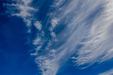 Natural Blue Sky Background On A Sunny Day With Clouds Stock Photo