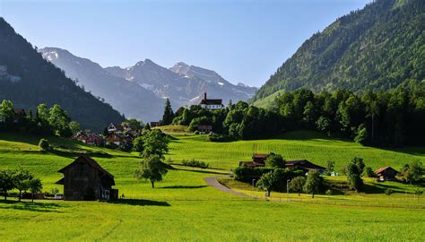 823877 4k 5k Schwyz Switzerland Mountains Roads Grasslands