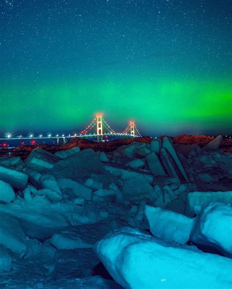 Photo Capturing Northern Lights Over Blue Ice Mackinac Bridge Is