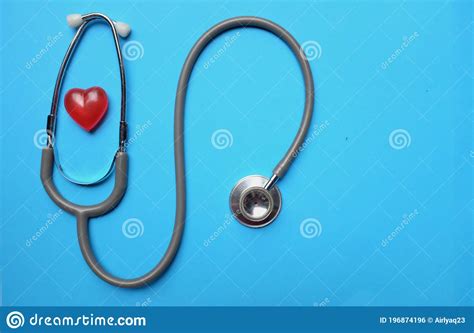 A Stethoscope And A Red Heart On A Blue Background Stock Photo Image