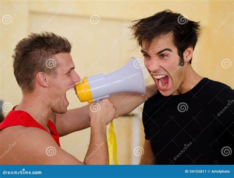 Personal Trainer Motivating Client Yelling With Megaphone Stock Image