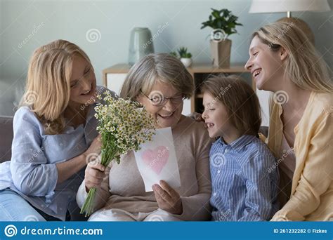 Loving Multigenerational Women Congratulating Senior Older Granny On