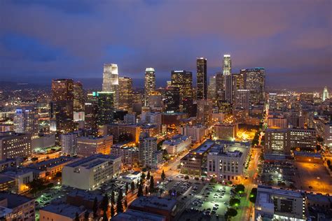 The exact times when evening begins and ends depend on location, time of year, and culture, but it is generally regarded as beginning when the sun is low in the sky and lasting until the end of twilight. City Glow | Downtown Los Angeles skyline as clouds and ...