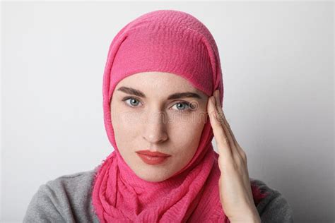 Headshot Portrait Of A Muslim Woman Wearing A Head Scarf Hijab And Smilling Isolated Stock