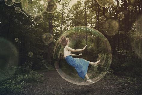 A Woman Is Falling And Stuck Inside A Bubble Royalty Free Stock Image