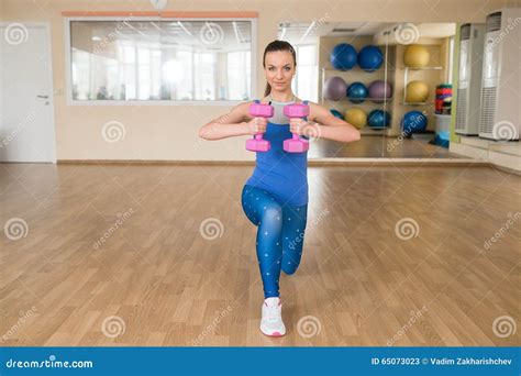 Young Woman Doing Fitness Exercises With Dumbbells Stock Image Image