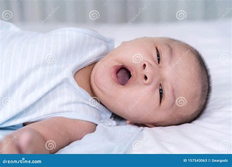 Yawning Baby On A Bed Stock Image Image Of Childhood 157543063