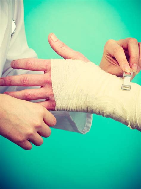 Doctor Bandaging Sprained Wrist Stock Photo Image Of Young Wrist