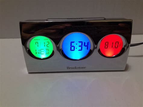 Brookstone Bright Backlight Travel Alarm Clock With Temperature Arm