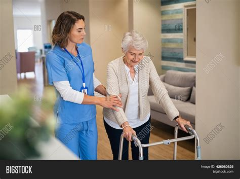 Lovely Nurse Helping Image And Photo Free Trial Bigstock