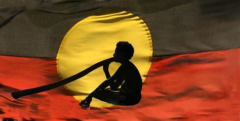 A Variation Of The Original Flag With A Man Playing The Didgeridoo In