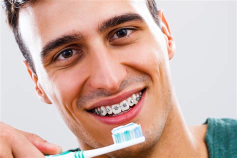 Guide To Flossing And Maintaining Oral Hygiene With Braces Pearly Whites Dental