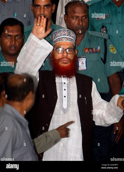 bangladeshi police officers escort delwar hossain sayeedi a leader of bangladesh s largest