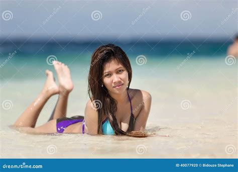 Filipina Woman Lying On Sand