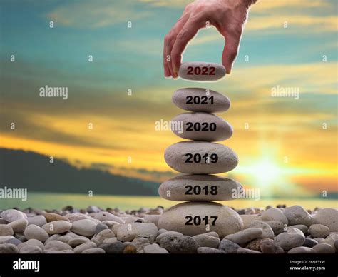 Happy new year 2022 concept. Years written on the rising stone pile ...