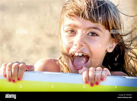Beautiful Eight Year Old Girl Smiling On The Beach Stock Photo Alamy