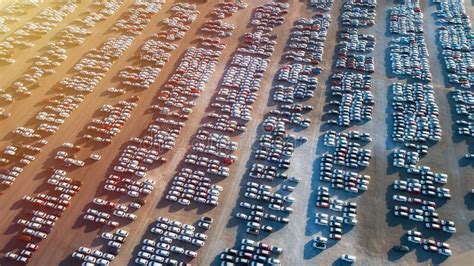 Aerial View Of Big Parking Lot Of New Cars Automobile Factory Stock