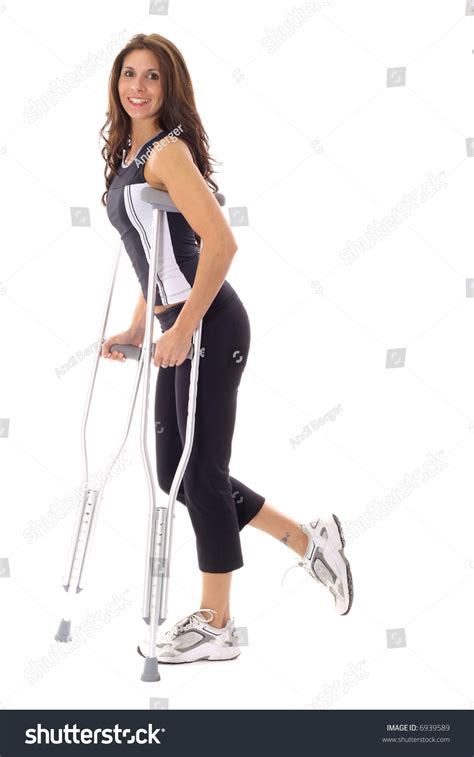 Happy Fitness Woman On Crutches Stock Photo 6939589