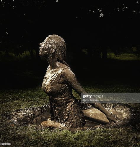 Woman Emerging From A Mud Hole Photo Getty Images