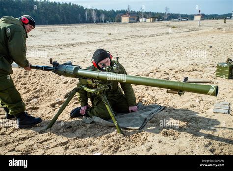 Cadet Charges Rocket Into Spg Recoilless Gun During Firing Training