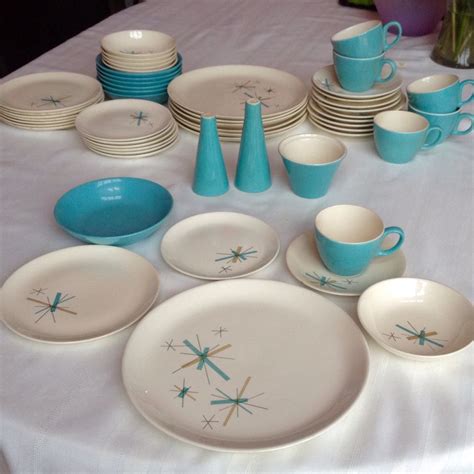 A Table Topped With Blue And White Dishes