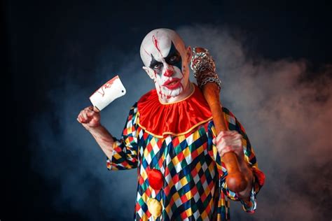 Premium Photo Bloody Clown With Meat Cleaver And Baseball Bat