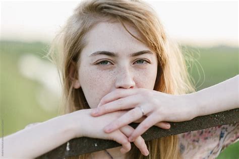 Portrait Of A Beautiful Thoughtful Girl With Freckles Close Up By