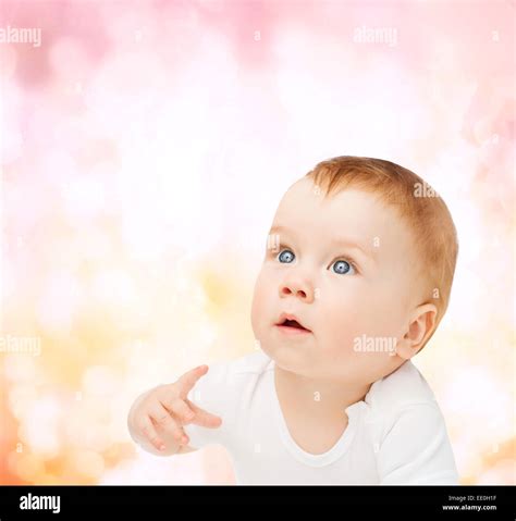 Curious Baby Looking Up Stock Photo Alamy