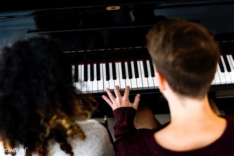 Couple Praticing On A Piano Together Premium Image By
