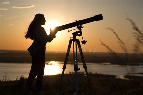 Silhouette Of Woman Looking Through Telescope Stock Photo Image Of