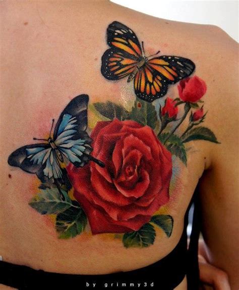 It's a personal touch to a. Two butterflies pose with a red rose flower in this ...