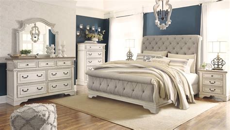Sleigh beds are a classic style that you will love for a long time. Realyn Queen Size Bed