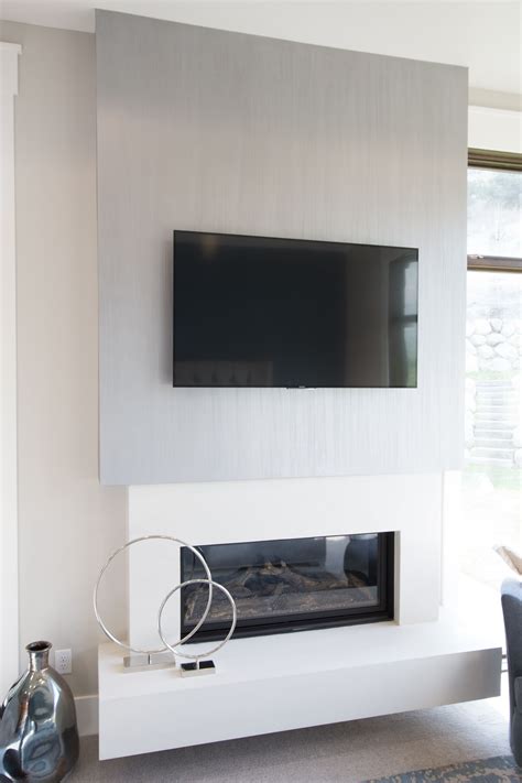 Blue accents in a tan bedroom. Mounted TV accent wall with a contemporary look. | Italian ...