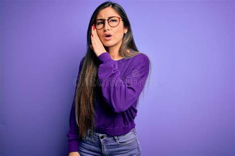 Young Beautiful Smart Woman Wearing Glasses Over Purple Isolated Background Hand On Mouth