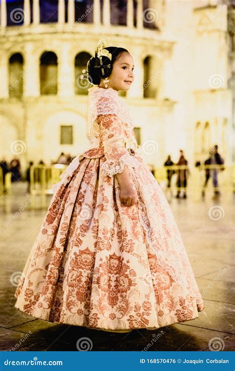 Portrait Of A Latina Fallera Girl Wearing The Traditional Valencian Costume Of Fallas Stock