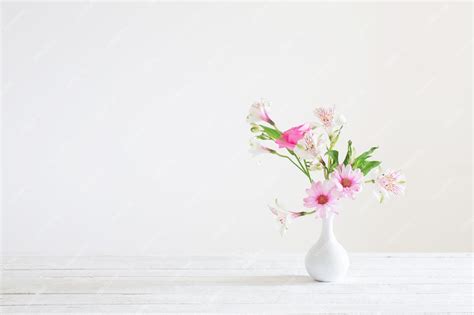 Premium Photo Pink And White Flowers In Vase On White Background