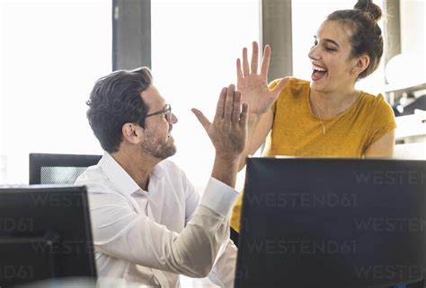 Business People Giving High Five While Working Together St Office Stock