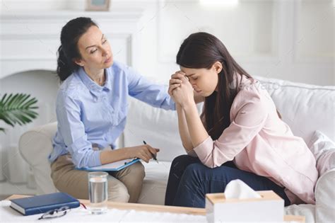 Therapist Comforting Her Depressed Crying Woman Patient Stock Photo By