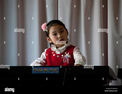 Young North Korean Girl Playing Piano In Kwangbok School Pyongan