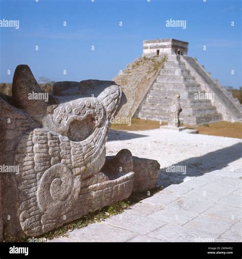 CHICHEN ITZA YUKATAN A Snake Head At The Temple Of The Warriors In The Background Stands El