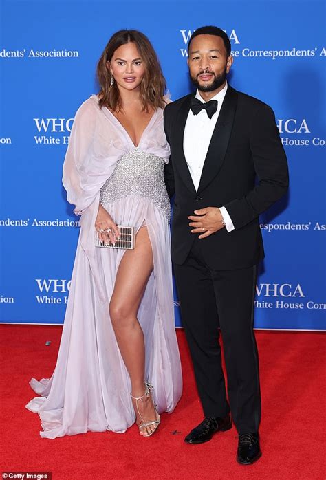 Chrissy Teigen Looks Glamorous In A Thigh Split Gown As She Cosies Up
