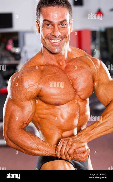 Professional Male Bodybuilder Posing In Gym Stock Photo Alamy