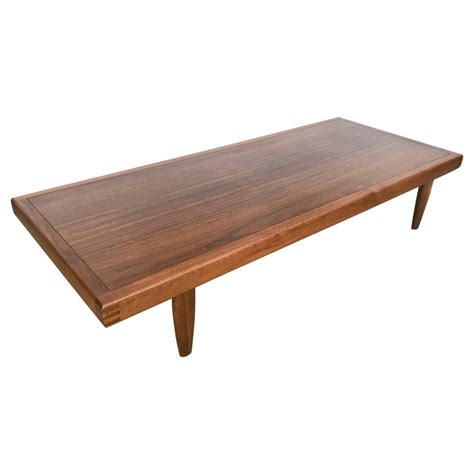 The table is constructed from wood and displays its wood. George Nakashima Coffee Table for Widdicomb at 1stdibs