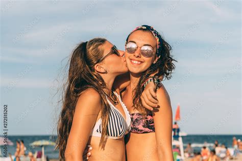 Happy Teens Kissing At The Beach Stock Photo Adobe Stock