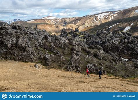 Hikers In Volcanic Mountains Of Landmannalaugar In Fjallabak Nature